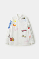 White shirt with colorful graphics simulating a plaster 